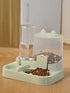 Automatic gravity pet feeder in action: food and water refill themselves as the cat eats